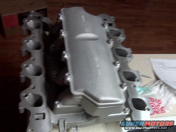 Aluminum intake manifold with "MADE IN CHINA" text visible