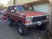 1978 Ford Bronco - This lifted 1978 Ford Bronco features a prominent chrome grille and a bright red exterior.