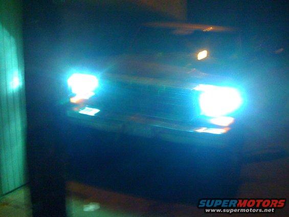 headlights and grille of a dark vehicle