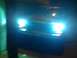 1978 Ford Bronco - The front of a vehicle is visible with its headlights illuminated.