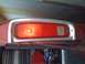 1978 Ford Bronco - Close-up view of a vehicle's red taillight assembly, a chrome bezel.