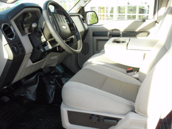 Interior view of a truck's dashboard and seats