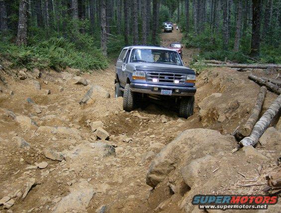 1996 Ford Bronco on a rocky forest trail