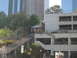 1986 Ford Bronco - A funicular railway with two cars is seen ascending a hill, surrounded by urban architecture.
