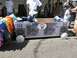 1986 Ford Bronco - A soapbox derby car designed to look like a boombox is seen at an event.