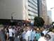 1986 Ford Bronco - A large crowd gathers under a Red Bull archway during an event in a city with tall buildings.