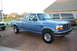 1995 Ford Bronco - This blue pickup truck, likely a mid-1990s Ford F-Series, is shown from a three-quarter front perspective.