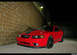 2004 Ford Mustang - This red Mustang is parked outside at night with a black stripe on the hood.