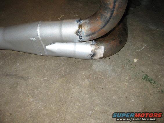 Welded exhaust pipe section on concrete floor
