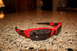 2004 Ford Mustang - A pair of red Oakley sunglasses rests on a granite countertop.