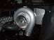 1992 Nissan 240SX - Close-up of a turbocharger, a component used to increase engine power.