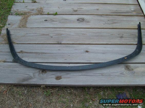 Curved black trim piece with mounting holes