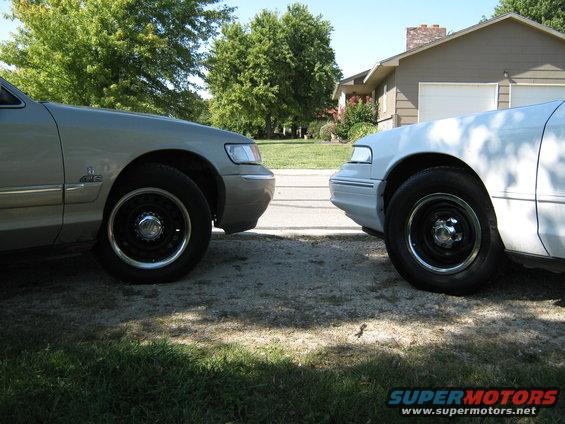 Silver 2000 Mercury Grand Marquis front quarter panel and wheel