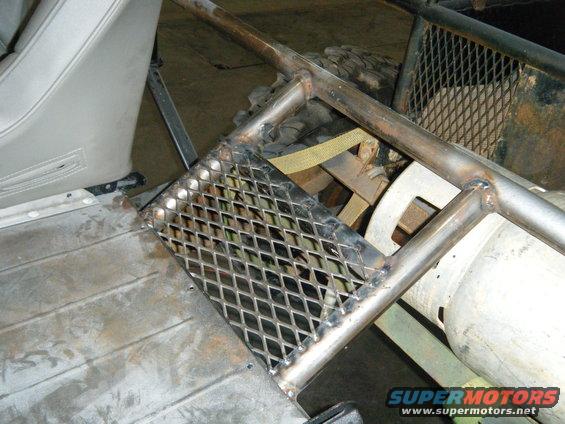 Diamond plate step and roll cage inside a vehicle interior