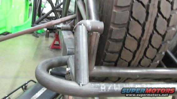 close-up of custom suspension components and tire on an off-road vehicle