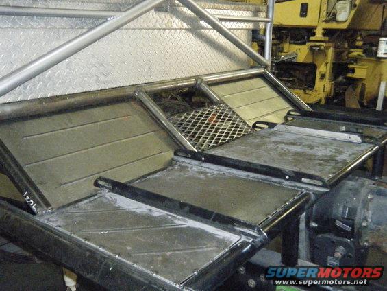 Custom metal fabrication with diamond plate and roll cage tubing, possibly for a vehicle