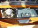 1984 Ford LTD - Close-up of the interior ashtray and radio controls, wood grain trim.