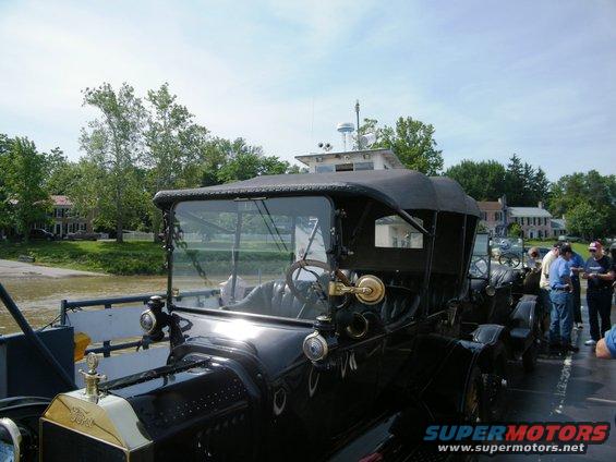 Black 1915 Ford Model T touring car on a ferry, front view