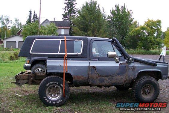 Modified Chevrolet K5 Blazer with snorkel, lifted, and a second vehicle partially visible behind it