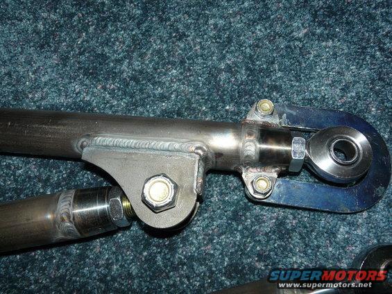 Close-up of custom suspension linkage with welds and bolts