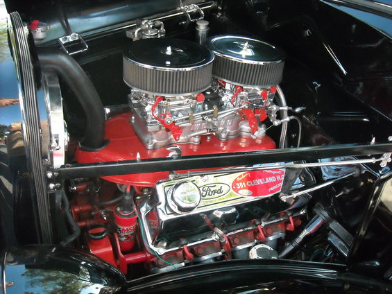 Close-up of a Ford 351 Cleveland engine with dual carburetors and red accents
