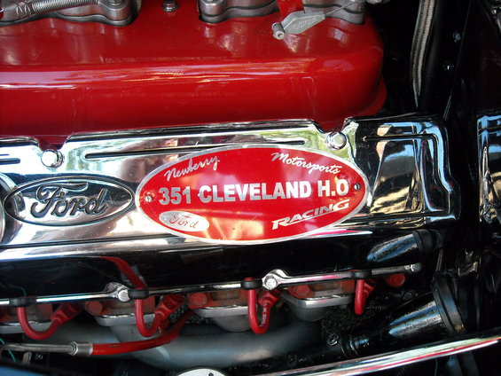 Close-up of a red Ford 351 Cleveland H.O. engine with a Newberry Motorsports Racing badge
