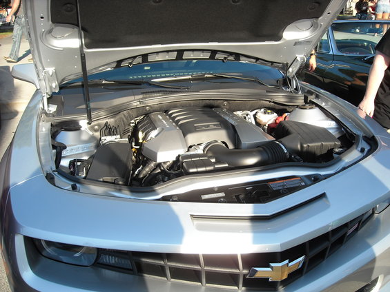 Silver Chevrolet Camaro engine bay with hood open