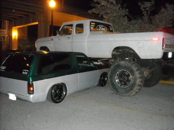 Lifted 1979 Ford F-150 truck over a lowered SUV