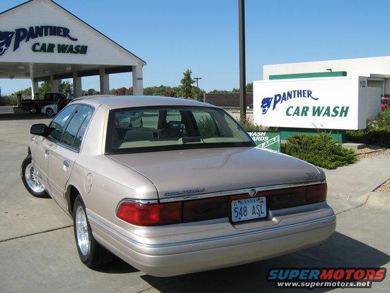 Tan Mercury Grand Marquis parked outside Panther Car Wash