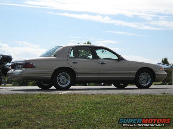 Tan 2000 Mercury Grand Marquis sedan, side view