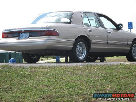 Tan 2000 Mercury Grand Marquis rear view with wire wheels