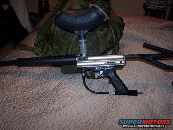 Silver paintball gun with black barrel and hopper