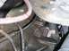 1979 Chevrolet C/K Pickup - Engine component detail with arrows indicating a tab and a bolt connection point.