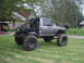 1984 Ford Bronco II - This heavily modified SUV features oversized tires and a custom roll cage, suggesting it's built for off-road use.