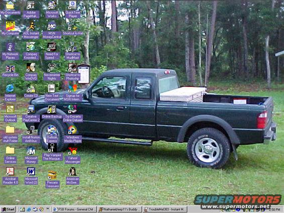 Dark green pickup truck parked on grass, toolbox in bed. Windows XP desktop icons visible