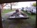 1900 Ford C-350 (Centurion Conversions) - Trailer and vehicles parked in a yard.