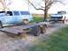 1900 Ford C-350 (Centurion Conversions) - Blue SUV and white Dodge pickup truck are parked with a car hauler trailer.