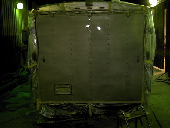 rear doors of a trailer covered in plastic sheeting