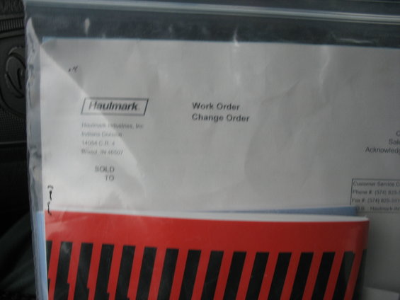 Document with Haulmark logo, work order, and change order details