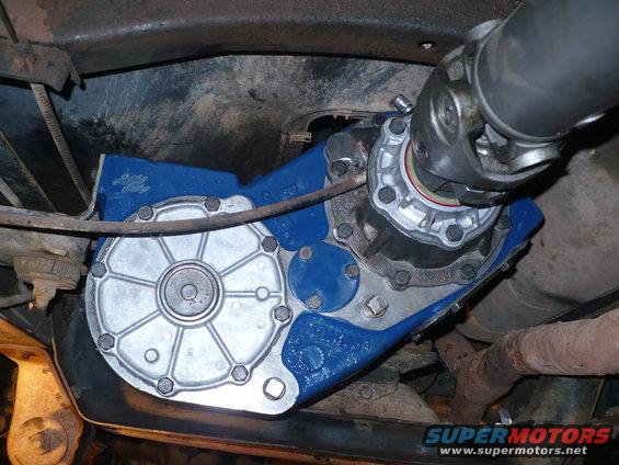 NP205 transfer case with blue paint, viewed from underneath a vehicle