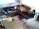 1969 Ford Mustang - Work is underway on the trunk floor and rear quarter panel of a classic vehicle, showing structural repairs.