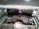 1969 Ford Mustang - Underside view of a car's rear axle and frame components.