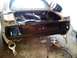 1969 Ford Mustang - Rear end of a 1969 Ford Mustang undergoing body repair, with tools visible.