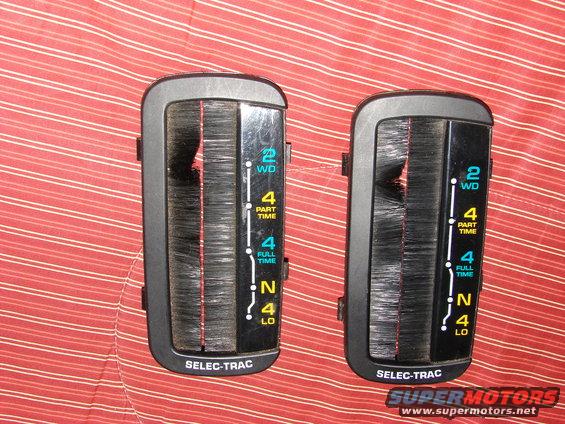 Two black transfer case shifter assemblies with "SELEC-TRAC" text and gear indicators