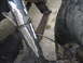 1984 Ford Bronco II - Close-up view of a vehicle's rear suspension system, showing the shock absorber, leaf spring, and tire.