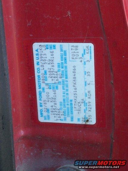 Red truck door sticker with manufacturing date 02/85 and VIN