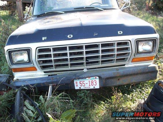 Front view of a 1979 Ford F-Series truck with a blue hood and chrome grille. Wisconsin license plate B 55-183