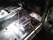 1969 Ford Mustang - Interior view of a car's floor, showing exposed metal, rust, and wiring, suggesting restoration work.