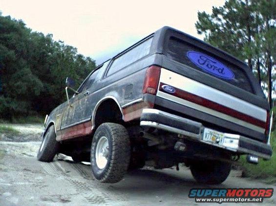 1991 Ford Bronco rear view, off-road, with Ford oval decal on rear window