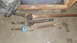 1997 Ford Ranger - Various driveshafts are laid out on a concrete surface, with a blue yoke visible on one.